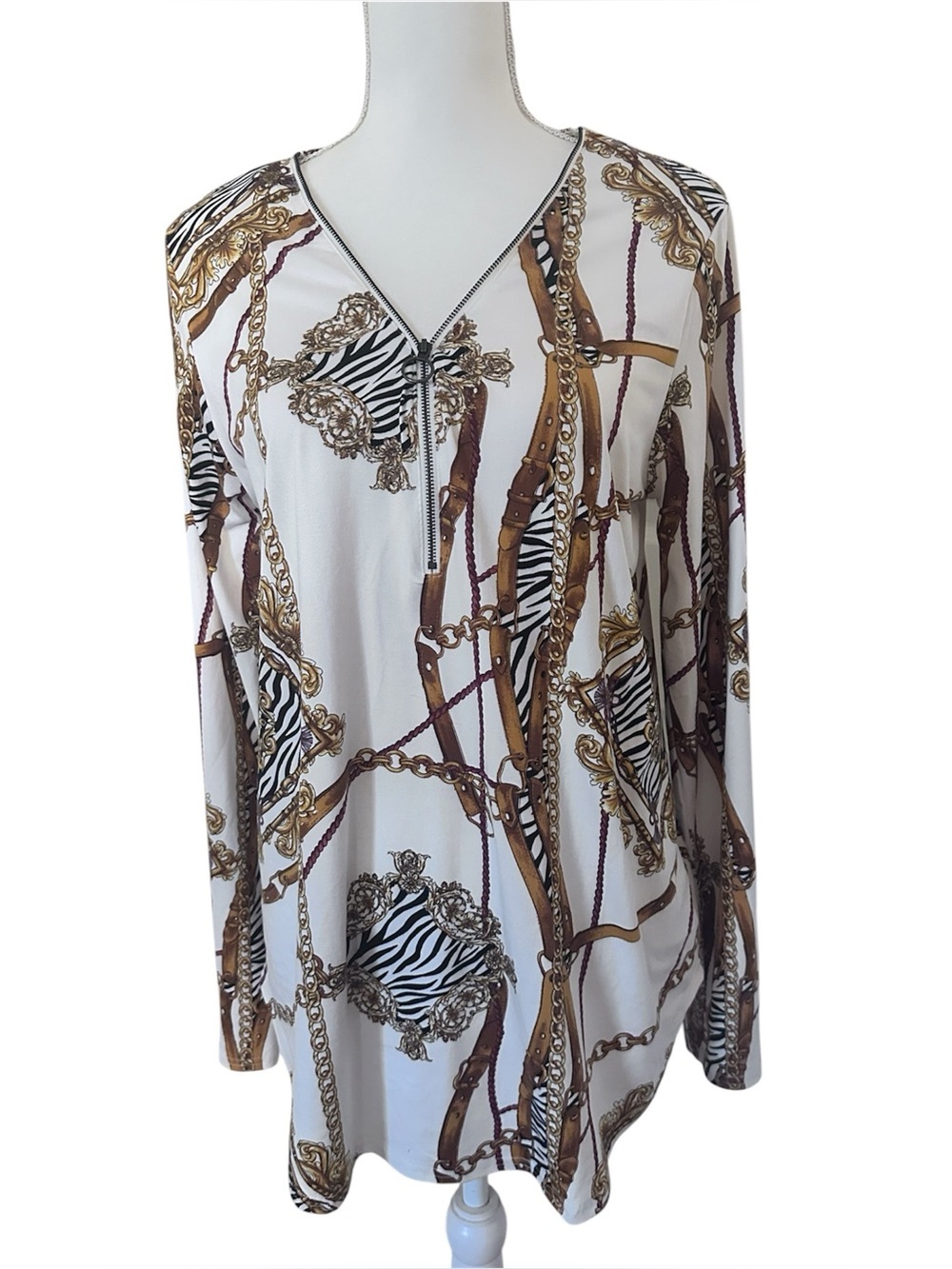 Buckle Black half zip tunic with equestrian chain and zebra print.